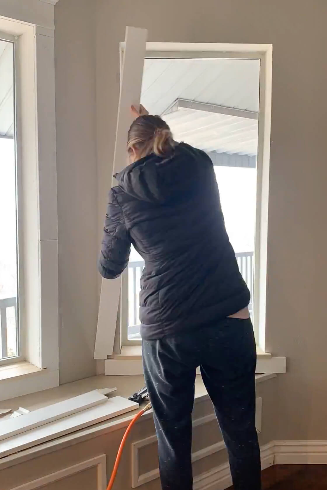 Adding a new window sill and window trim to a bay window.